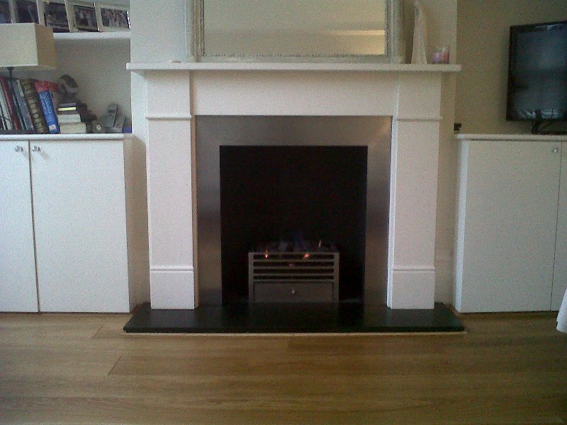 Classic limestone fire surround with stainless steel slips